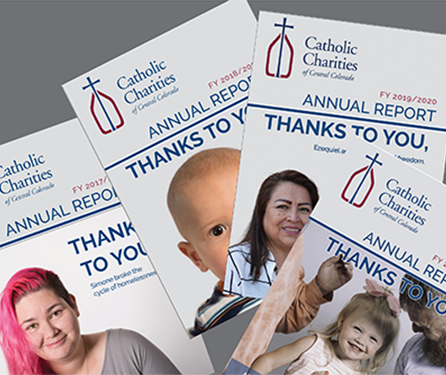 Image of multiple annual reports from Catholic Charities